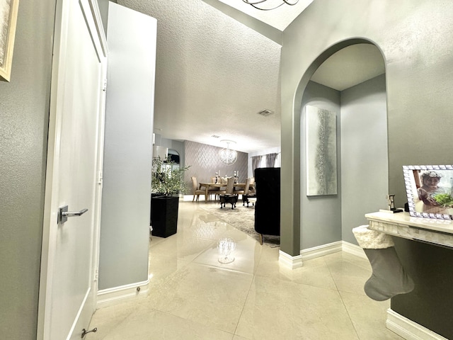 bathroom featuring tile patterned floors and a textured ceiling