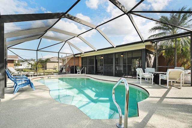 pool featuring a sunroom, a lanai, and a patio area