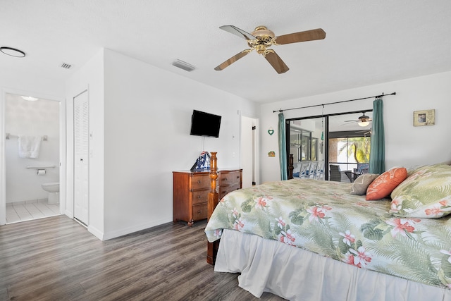 bedroom featuring access to outside, visible vents, connected bathroom, and wood finished floors