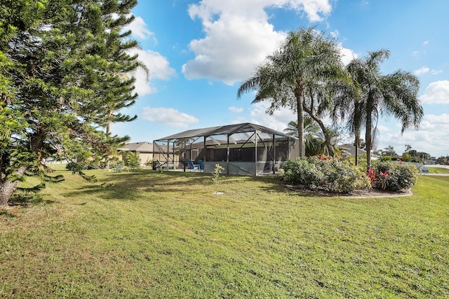 view of yard with a lanai