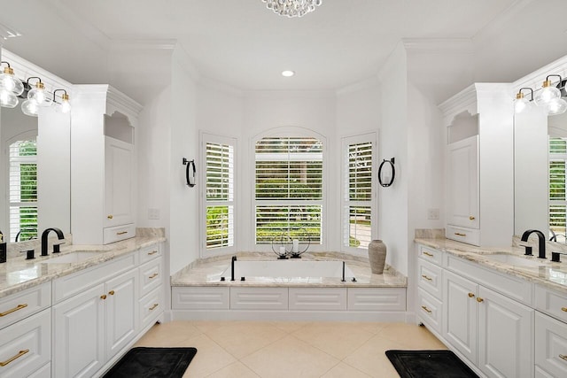 bathroom featuring crown molding, tile patterned floors, a bathtub, and vanity