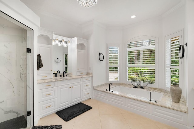 bathroom featuring independent shower and bath, vanity, ornamental molding, and tile patterned floors