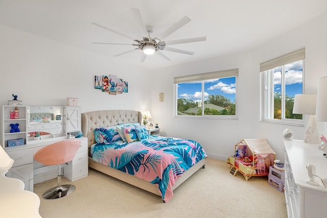 carpeted bedroom featuring ceiling fan