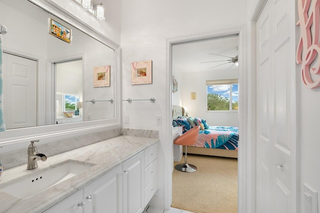 bathroom with vanity, a healthy amount of sunlight, and ceiling fan