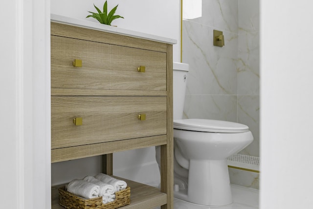 bathroom with tile walls