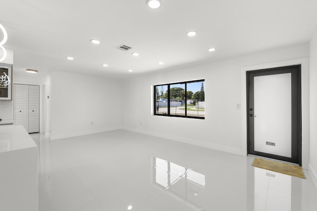 unfurnished living room featuring tile patterned floors