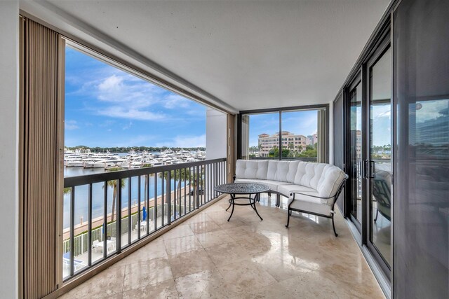 living area with marble finish floor, floor to ceiling windows, and visible vents