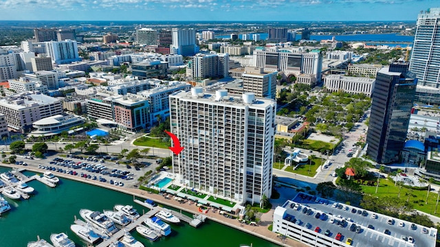 birds eye view of property with a city view and a water view