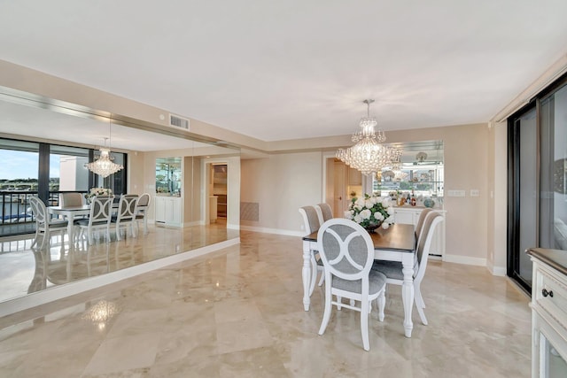 400 N Flagler Dr Unit 506, West Palm Beach, FL 33401 - dining area featuring a chandelier, baseboards, and light marble finish flooring