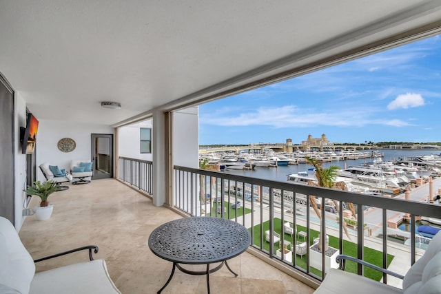 balcony featuring a water view