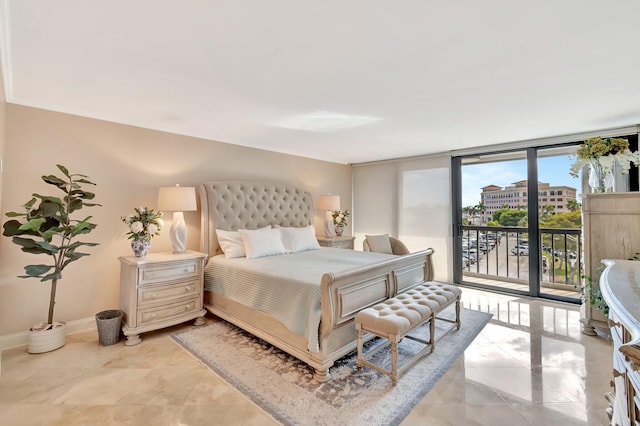 bedroom with access to exterior, expansive windows, and baseboards