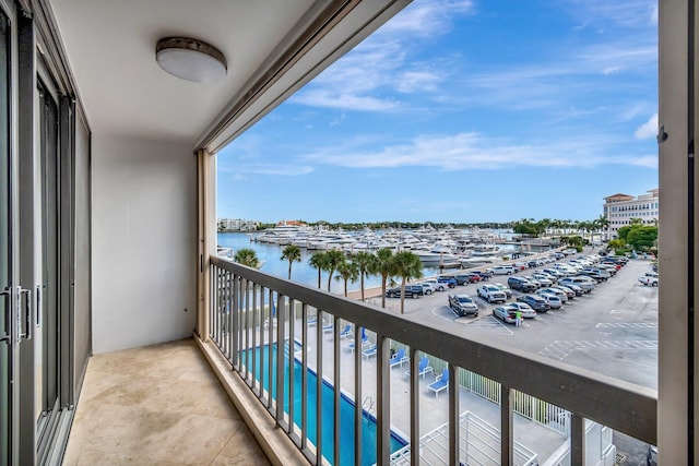 balcony featuring a water view