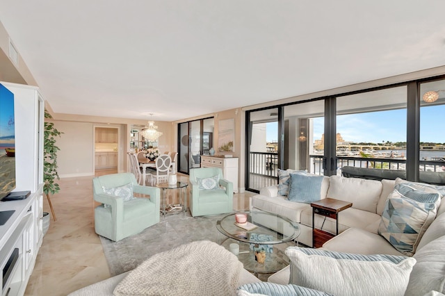400 N Flagler Dr Unit 506, West Palm Beach, FL 33401 - living room featuring a chandelier and a water view