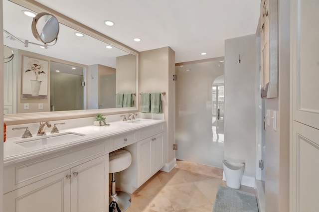 full bath featuring a stall shower, a sink, recessed lighting, and double vanity