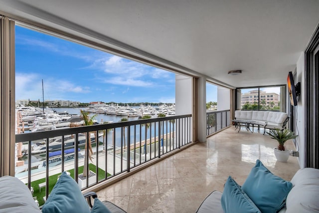 balcony featuring a water view