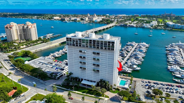 drone / aerial view featuring a water view and a city view