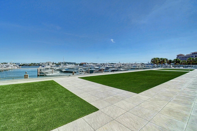 400 N Flagler Dr Unit 506, West Palm Beach, FL 33401 - view of green lawn featuring view of marina, a water view, and a dock
