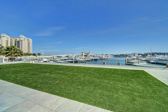 400 N Flagler Dr Unit 506, West Palm Beach, FL 33401 - view of grassy yard with a boat dock, a water view, and view of marina