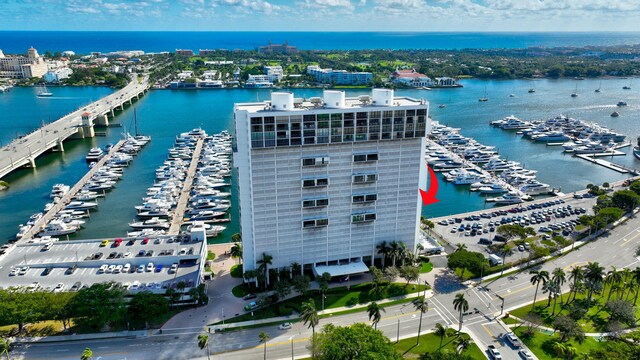 400 N Flagler Dr Unit 506, West Palm Beach, FL 33401 - drone / aerial view of numerous boat docks, a nearby body of water, and a notable bridge