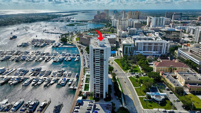 bird's eye view featuring a water view and a city view