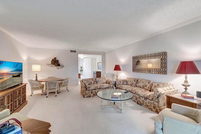 living room featuring crown molding, light colored carpet, and a textured ceiling