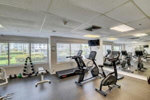 gym featuring a paneled ceiling