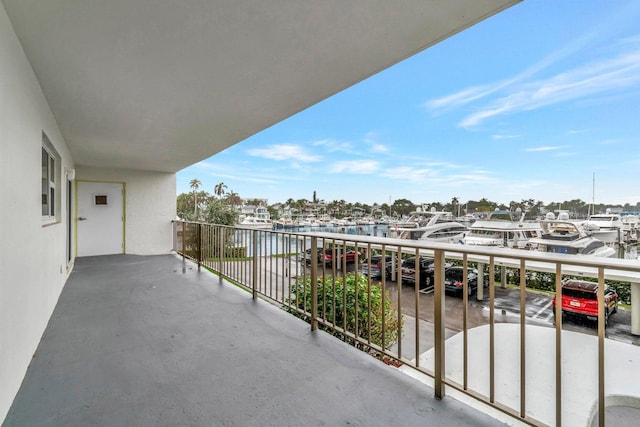 balcony featuring a water view