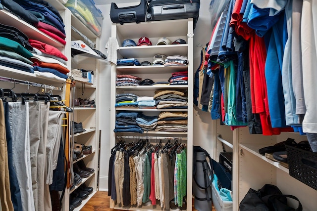 spacious closet featuring hardwood / wood-style floors