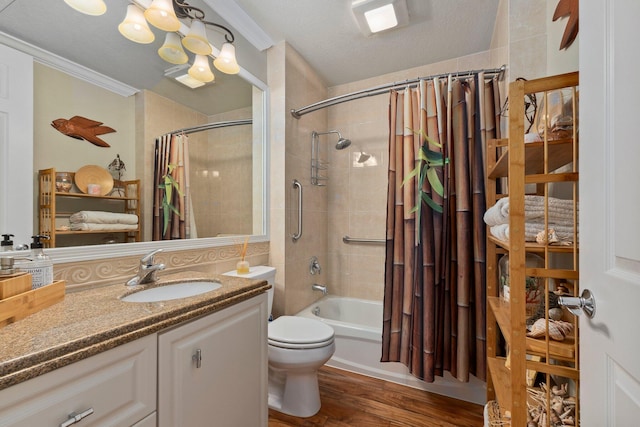 full bathroom with hardwood / wood-style floors, shower / bath combination with curtain, ornamental molding, vanity, and toilet