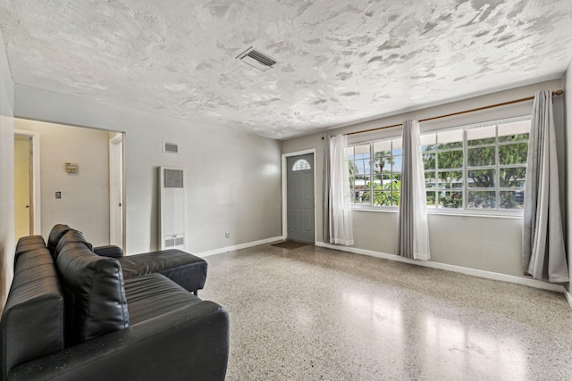 living room with a textured ceiling