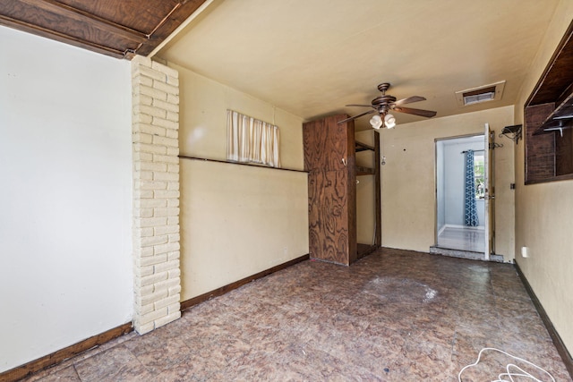 interior space with ceiling fan