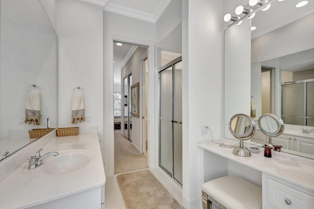 bathroom featuring vanity, crown molding, and a shower with door