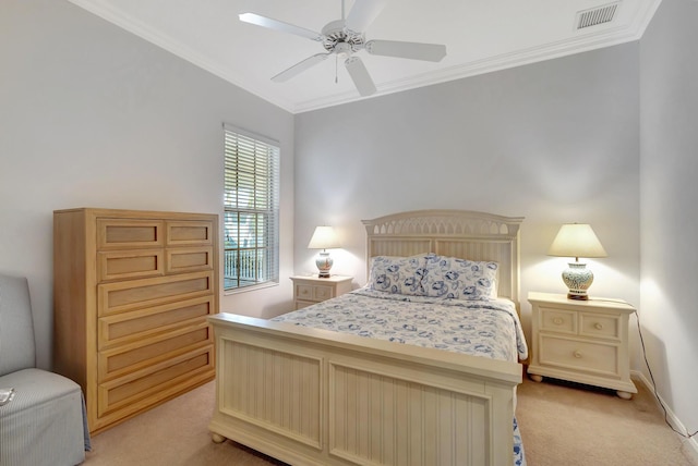 carpeted bedroom featuring ornamental molding and ceiling fan