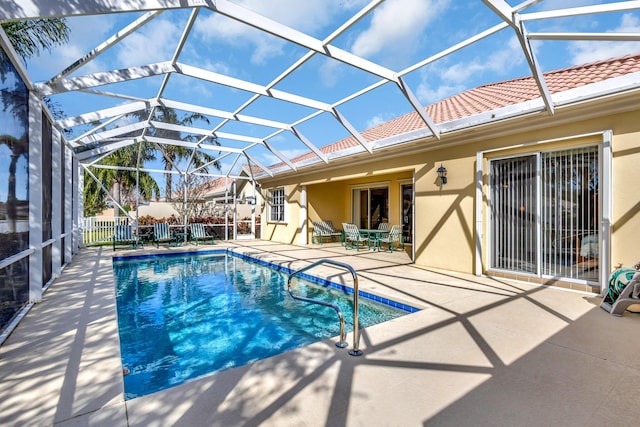 view of pool featuring a lanai and a patio area