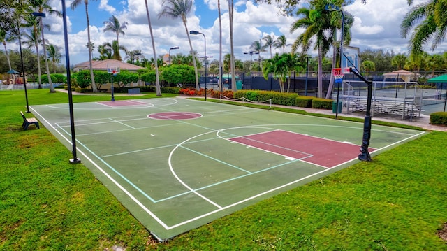 view of basketball court featuring a yard