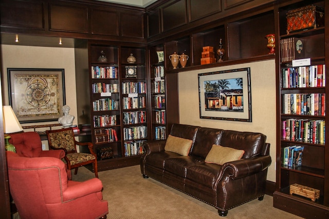 living area with light colored carpet and built in features