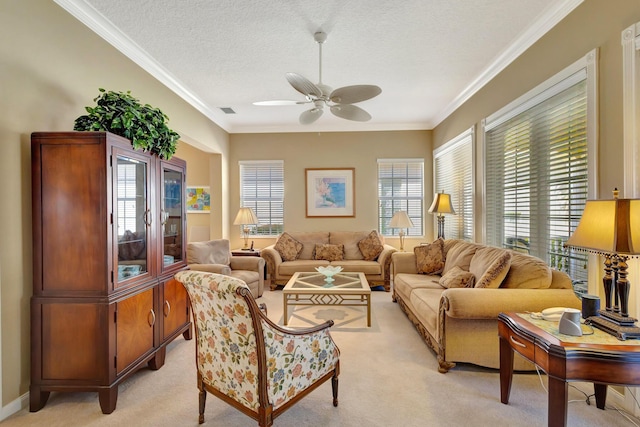 carpeted living room with ceiling fan, crown molding, and a textured ceiling