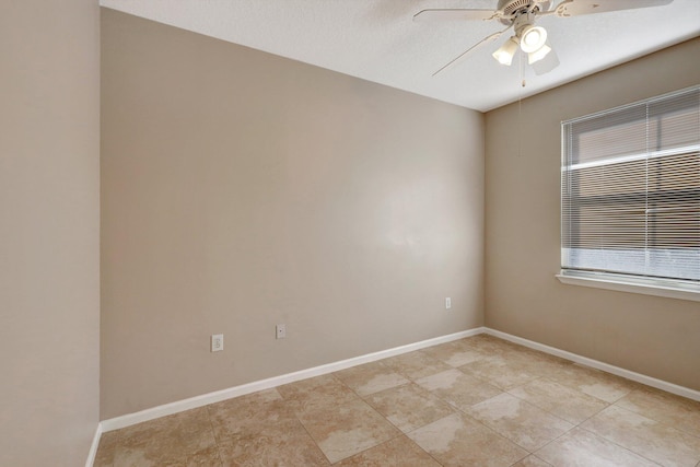 unfurnished room featuring ceiling fan and light tile patterned floors