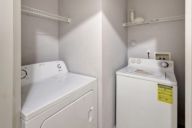 washroom featuring independent washer and dryer