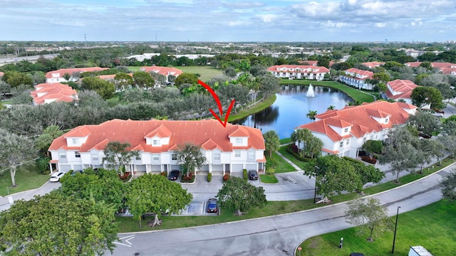 birds eye view of property with a water view