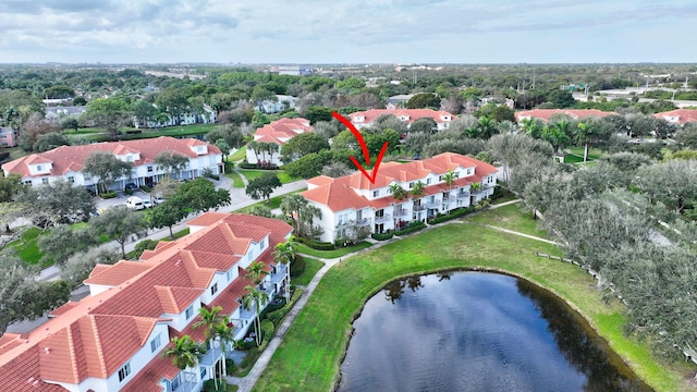 birds eye view of property featuring a water view