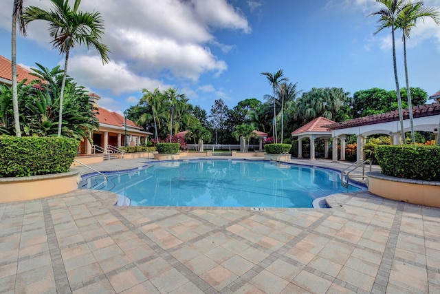 view of pool featuring a gazebo and a patio area