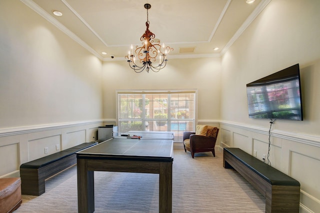 playroom featuring ornamental molding, a chandelier, and light carpet