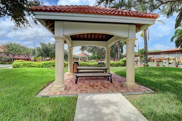 view of property's community featuring a gazebo and a lawn