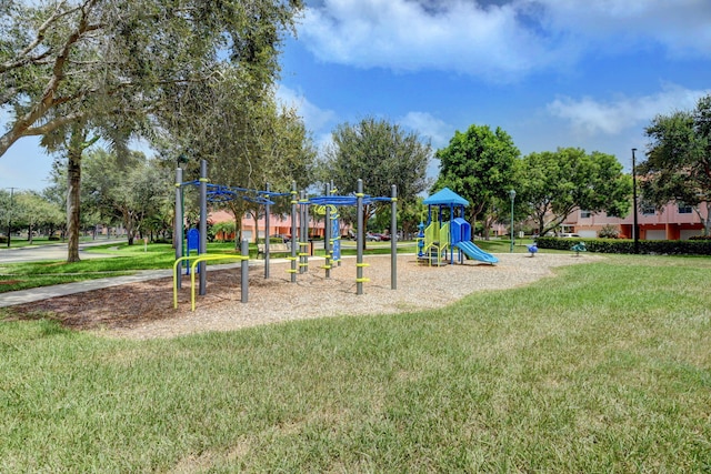 view of playground with a lawn