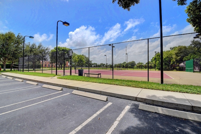 exterior space with tennis court