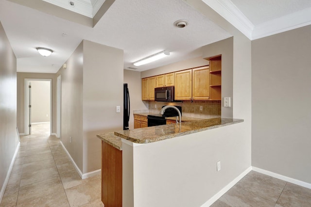 kitchen featuring light tile patterned floors, black appliances, kitchen peninsula, and light stone countertops