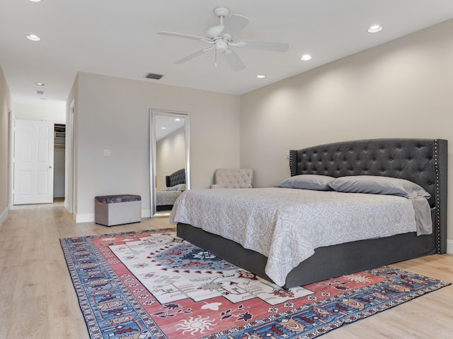 bedroom with wood-type flooring and ceiling fan