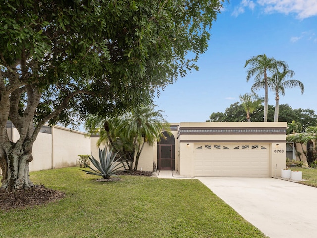 view of front facade with a garage and a front yard