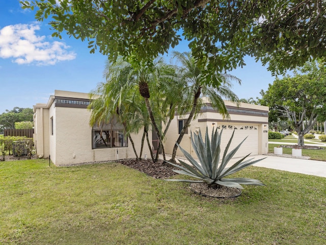 view of side of home with a garage and a lawn